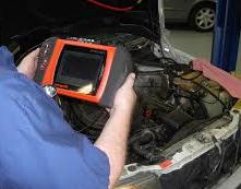 man fixing car engine