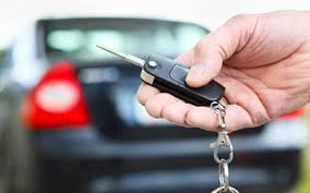 holding car key